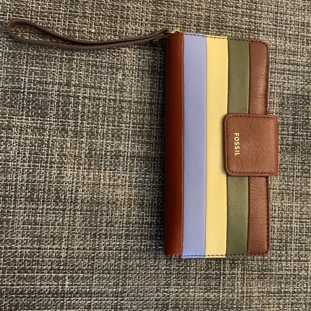 Fossil wristlet.  New. Never carried. Lots of space for your credit cards, etc.